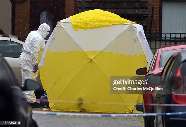 Forensic officers at the scene of the fatal shooting of former senior IRA figure, Gerard 'Jock' Davison on Welsh Street in the Markets area on May 5,...