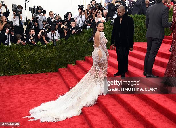 Kanye West and Kim Kardashian arrives at the 2015 Metropolitan Museum of Art's Costume Institute Gala benefit in honor of the museums latest exhibit...