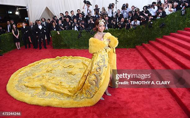 Rihanna arrives at the 2015 Metropolitan Museum of Art's Costume Institute Gala benefit in honor of the museums latest exhibit China: Through the...