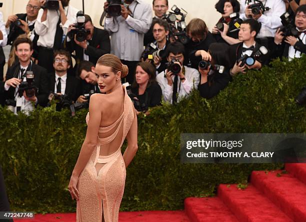 Rosie Huntington-Whiteley arrives at the 2015 Metropolitan Museum of Art's Costume Institute Gala benefit in honor of the museums latest exhibit...