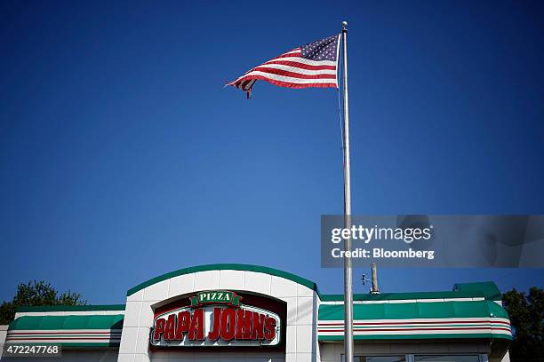 The U.S. Flag flies outside of a Papa John's International Inc. Restaurant in Louisville, Kentucky, U.S., on Friday, May 1, 2015. Papa John's is...