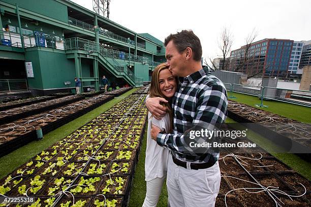 Tyler Tumminia, who oversees the business operations of four minor league baseball teams and co-owns a collegiate team, gets a hug and a kiss from...