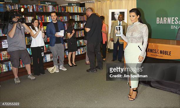 Personality Kim Kardashian signs copies cf "Selfish" at Barnes & Noble, 5th Avenue on May 5, 2015 in New York City.