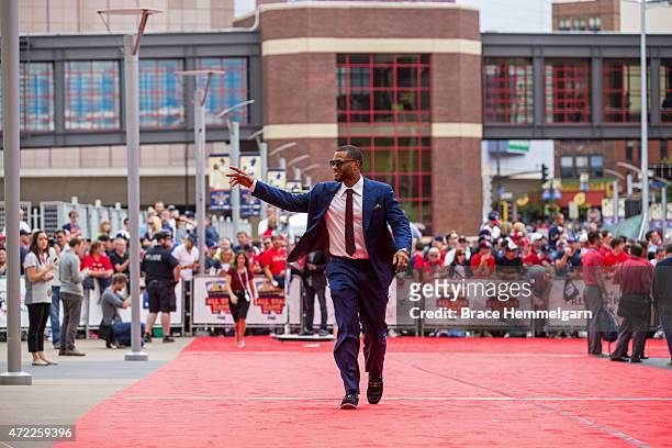American League All-Star Robinson Cano of the Seattle Mariners waves in the Red Carpet Parade leading to the 85th MLB All-Star Game at Target Field...