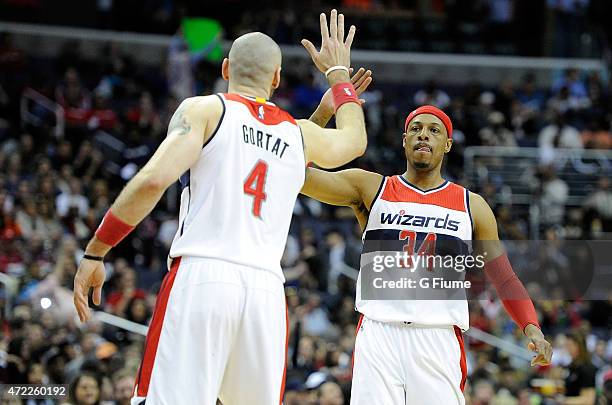 Paul Pierce of the Washington Wizards celebrates with Marcin Gortat during the game against the Toronto Raptors during Game Four of the Eastern...