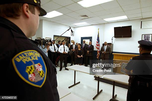 Attorney General Loretta Lynch accompanied by Baltimore police Commissioner Anthony Batts speaks with Baltimore police officers during a visit to the...