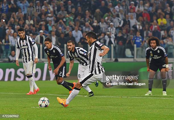 Carlos Tevez of Juventus scores their second goal from a penalty during the UEFA Champions League semi final first leg match between Juventus and...