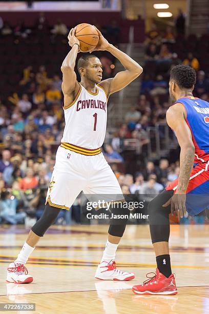 James Jones of the Cleveland Cavaliers looks for a pass while under pressure from Shawne Williams of the Detroit Pistons during the second half at...