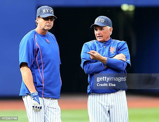 Manager Terry Collins of the New York Mets talks with a member of his coaching staff during batting practice before the game against the Baltimore...