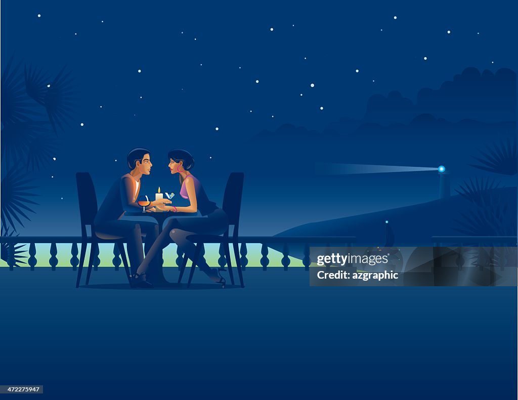 Couple in night coast cafe.