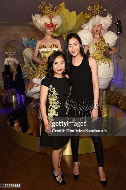 Designer Guo Pei and model Liu Wen attend the MAC x Guo Pei dinner on May 5, 2015 in New York City.