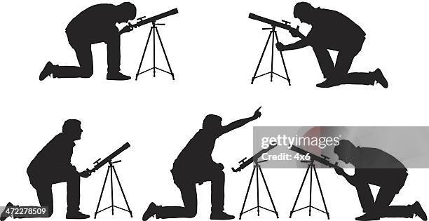 man with telescope stargazing - looking through telescope stock illustrations
