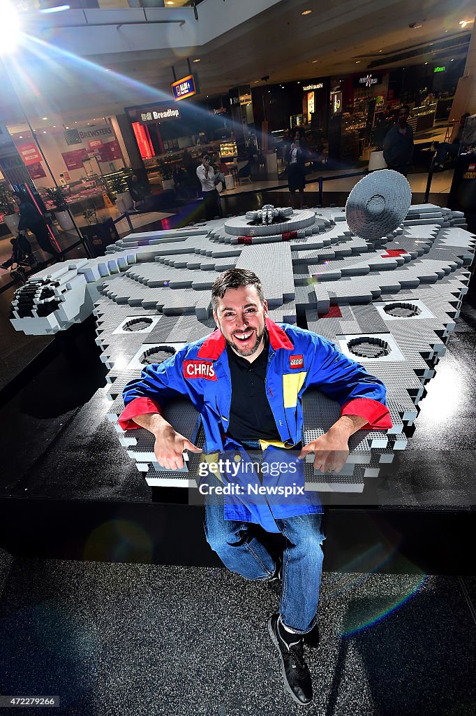 Lego Master Builder Chris Steininger Poses With The Millennium Falcon