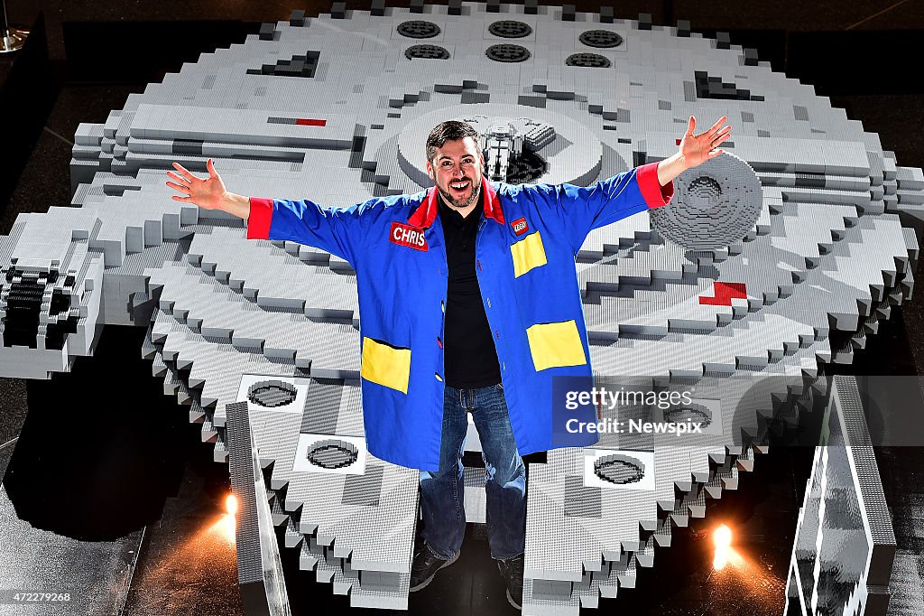Lego Master Builder Chris Steininger Poses With The Millennium Falcon