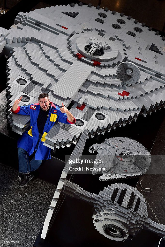 Lego Master Builder Chris Steininger Poses With The Millennium Falcon