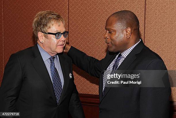 Sir Elton John, Founder, Elton John AIDS Foundation, talks with Douglas Brooks, Director, White House Office of National AIDS Policy, before an Elton...