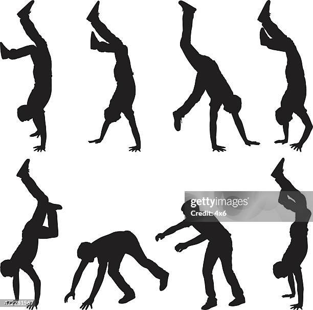 man doing handstands and walking on hands - handstand stock illustrations