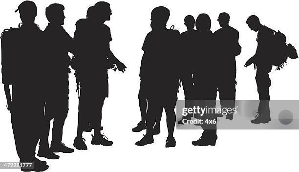 group of people gathering for backpacking hike - man backpacking stock illustrations