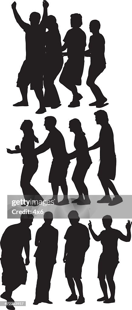 Friends at a party conga line dancing