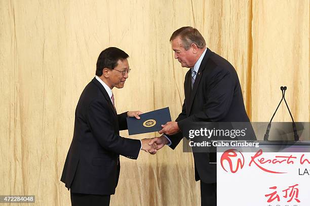 Chairman and CEO of the Genting Group K.T. Lim recieves a proclamation from Rep. Cresent Hardy, R-Nev., during the Genting Group's ceremonial...