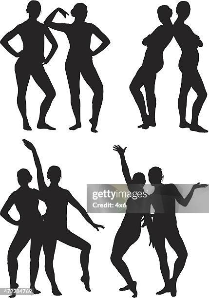 two female dancers in spandex posing together - flexing silhouette vector stock illustrations