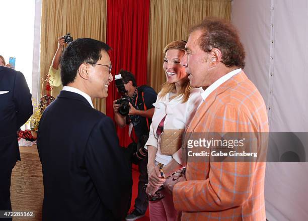 Chairman and CEO of the Genting Group K.T. Lim greets Andrea Hissom and her husband, Wynn Resorts Chairman CEO Steve Wynn during the Genting Group's...