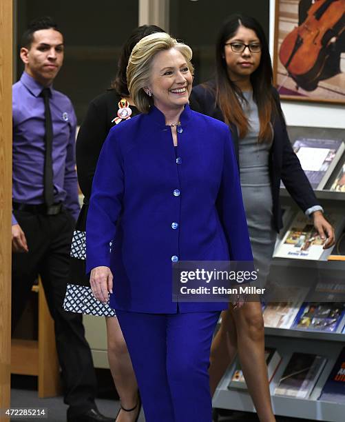 Democratic presidential candidate and former U.S. Secretary of State Hillary Clinton , flanked by Rafael Lopez and Erika Castro , arrives at Rancho...