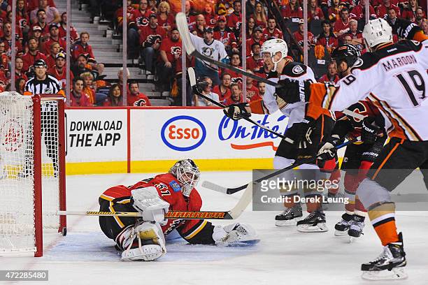 Patrick Maroon of the Anaheim Ducks scores against Karri Ramo of the Calgary Flames in Game Three of the Western Conference Semifinals during the...