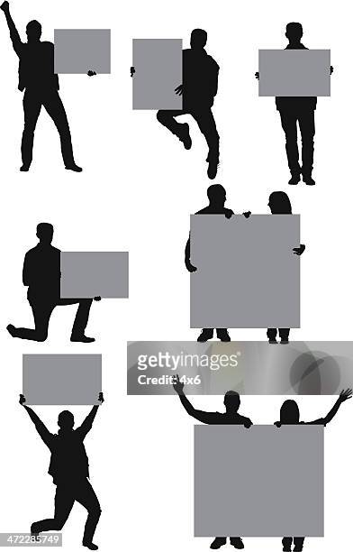 lässig menschen mit schilder - person holding up sign stock-grafiken, -clipart, -cartoons und -symbole