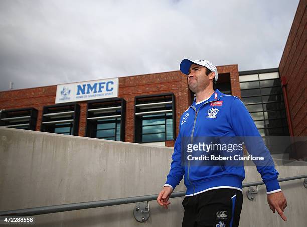 Kangaroos coach Brad Scott walks out for a North Melbourne Kangaroos AFL training session at Arden Street Ground on May 6, 2015 in Melbourne,...