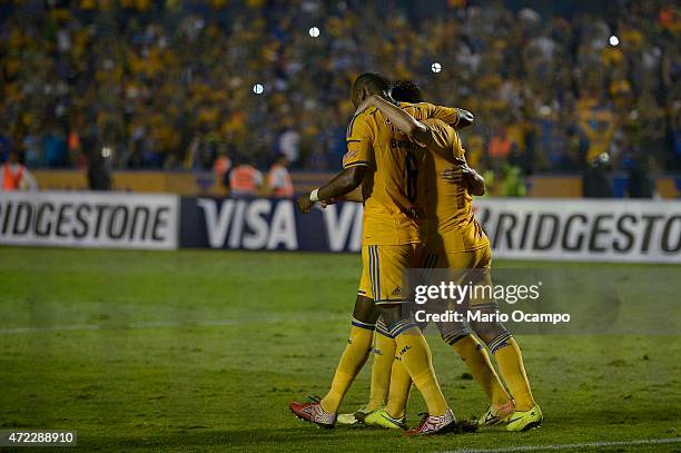 Rafael Sobis of Tigres celebrates with teammates after scoring his team's first goal by a penalty kick during a second leg match between Tigres and...