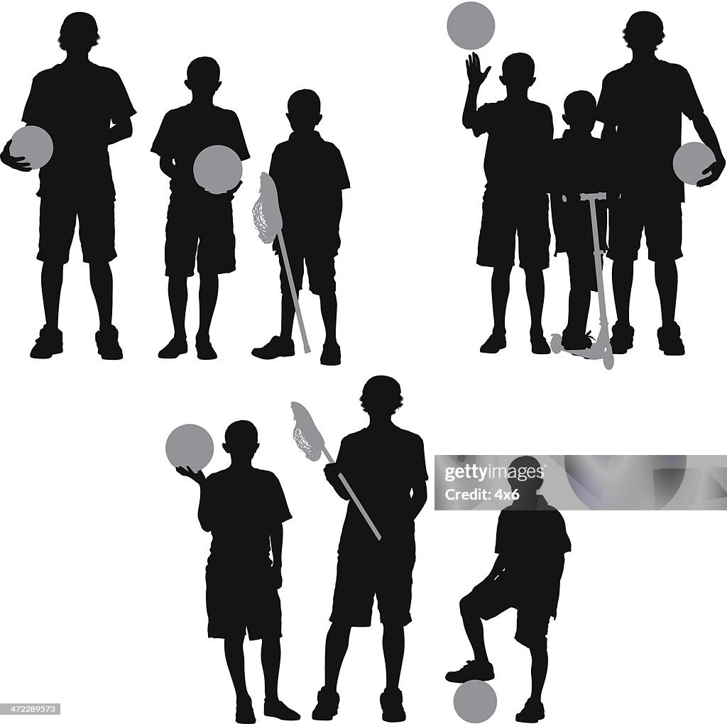 Children standing with sport equipment
