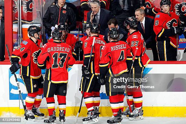 Head coach Bob Hartley of the Calgary Flames instructs his players during a timeout against the Anaheim Ducks at Scotiabank Saddledome for Game Three...