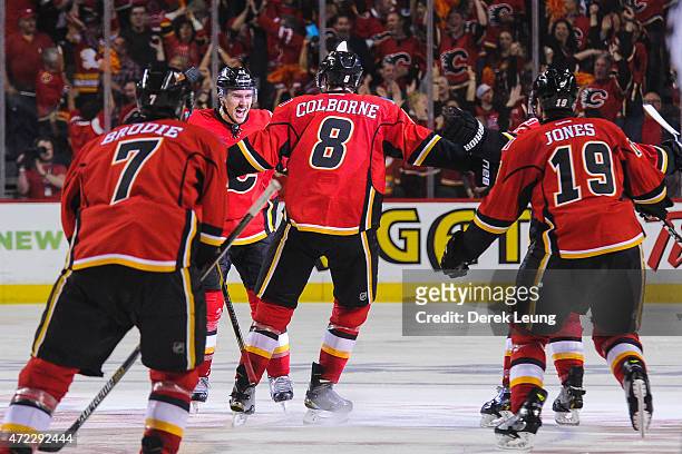 Mikael Backlund of the Calgary Flames scores the game winning goal in overtime against the Anaheim Ducks in Game Three of the Western Conference...