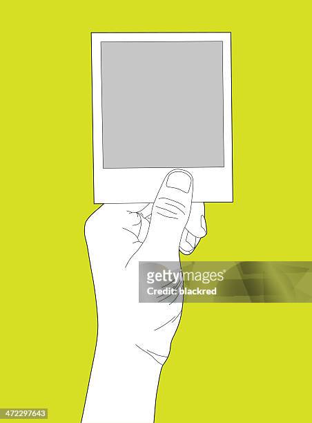 hand holding blank instant photo - single object photos stock illustrations