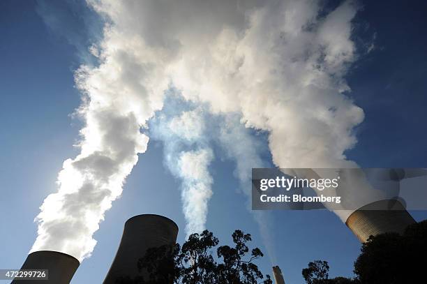 Steam billows from the cooling towers of the Yallourn coal-fired power station operated by EnergyAustralia Holdings Ltd., a unit of CLP Holdings...