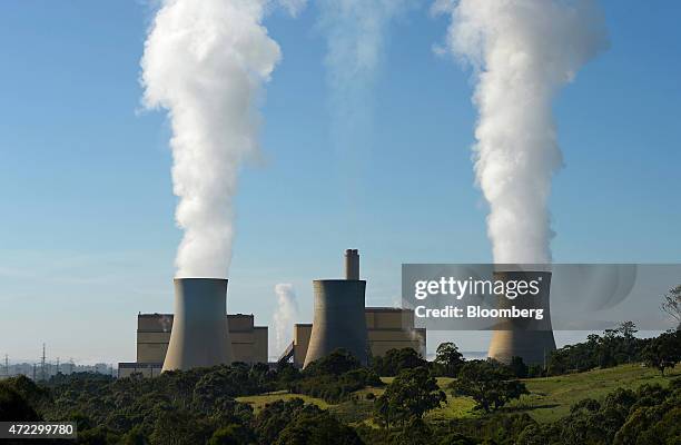 Steam billows from the cooling towers of the Yallourn coal-fired power station operated by EnergyAustralia Holdings Ltd., a unit of CLP Holdings...