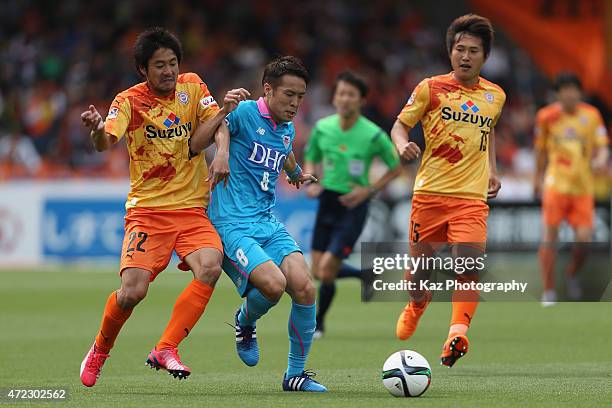 Kota Mizunuma of Sagan Tosu and Takuma Edamura of Shimizu S-Pulse compete for the ball during the J.League match between Shimizu S-Pulse and Sagan...