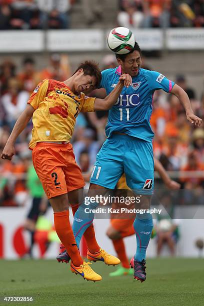 Yohei Toyoda of Sagan Tosu and Genta Miura of Shimizu S-Pulse compete for the ball during the J.League match between Shimizu S-Pulse and Sagan Tosu...