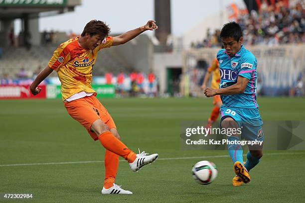 Shun Nagasawa of Shimizu S-Pulse and Hiroyuki Taniguchi of Sagan Tosu compete for the ball during the J.League match between Shimizu S-Pulse and...