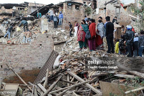 Survivors of the earthquake search through damaged buildings, looking for signs of life on April 29, 2015 in Kathmandu, Nepal. A major 7.8 earthquake...
