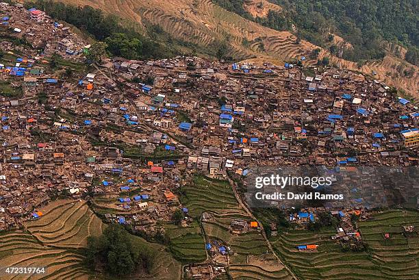 Damaged houses are seen from an Indian Helicopter on May 6, 2015 in Barpak, Nepal. A major 7.9 earthquake hit Kathmandu mid-day on Saturday 25th...