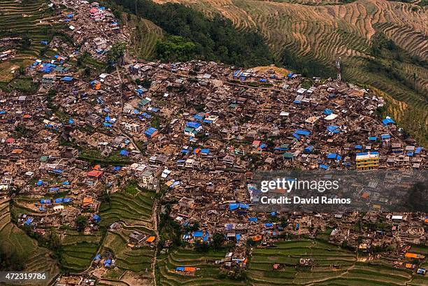 Damaged houses are seen from an Indian Helicopter on May 6, 2015 in Barpak, Nepal. A major 7.9 earthquake hit Kathmandu mid-day on Saturday 25th...