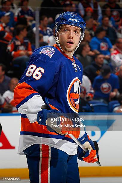 Nikolay Kulemin of the New York Islanders skates against the Washington Capitals during Game Three of the Eastern Conference Quarterfinals during the...