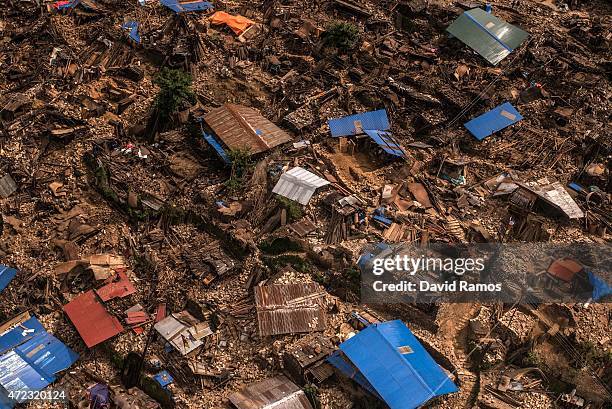Damaged houses are seen from an Indian Helicopter on May 6, 2015 in Khanigaun, Nepal. A major 7.9 earthquake hit Kathmandu mid-day on Saturday 25th...