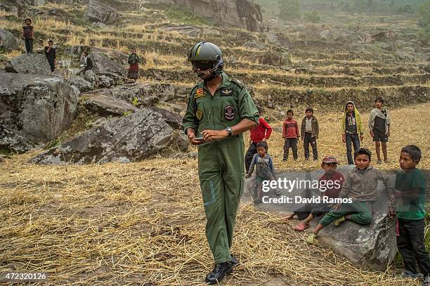 An Indian Air Force pilot supervises an aid dropping operation on May 6, 2015 in Hulchuk, Nepal. A major 7.9 earthquake hit Kathmandu mid-day on...