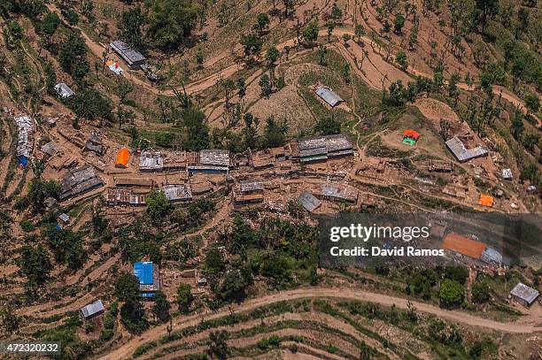 Damaged houses are seen in a village from an Indian Helicopter on May 6, 2015 near Gorkha, Nepal. A major 7.9 earthquake hit Kathmandu mid-day on...