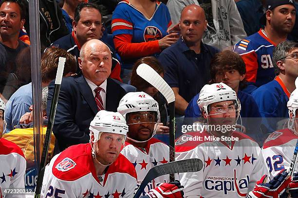 Barry Trotz of the Washington Capitals looks on against the New York Islanders during Game Three of the Eastern Conference Quarterfinals during the...