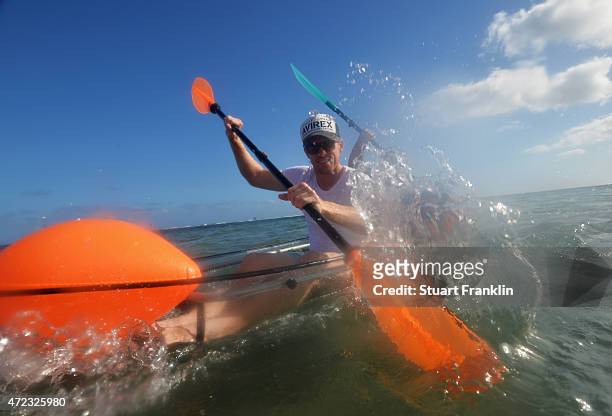 Andrew Dodt of Australia and caddie go kayaking prior to the start of the AfrAsia Bank Mauritius Open at Heritage Golf Club on May 6, 2015 in Bel...