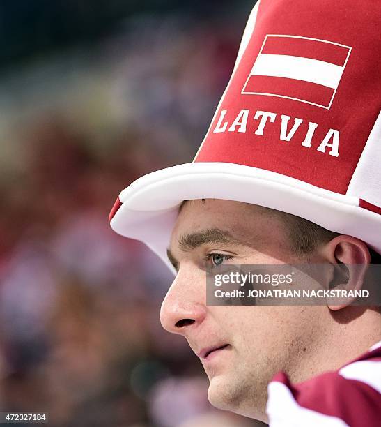 Latvian ice hockey supporter watches the group A preliminary round match Switzerland vs Latvia at the 2015 IIHF Ice Hockey World Championships on May...